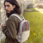 man holding buddhaland hemp bag on shoulder